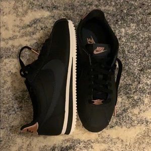black and rose gold nike cortez